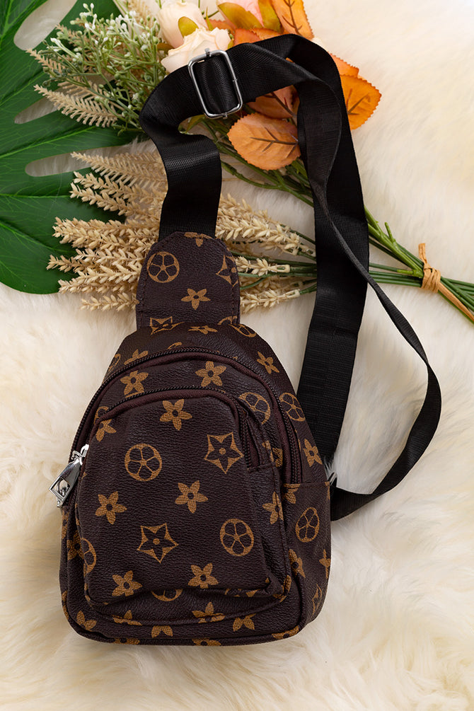 BROWN STAR PRINTED SLING BAG.