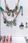 COPY OF PIECE NECKLACE & CHARM SET.