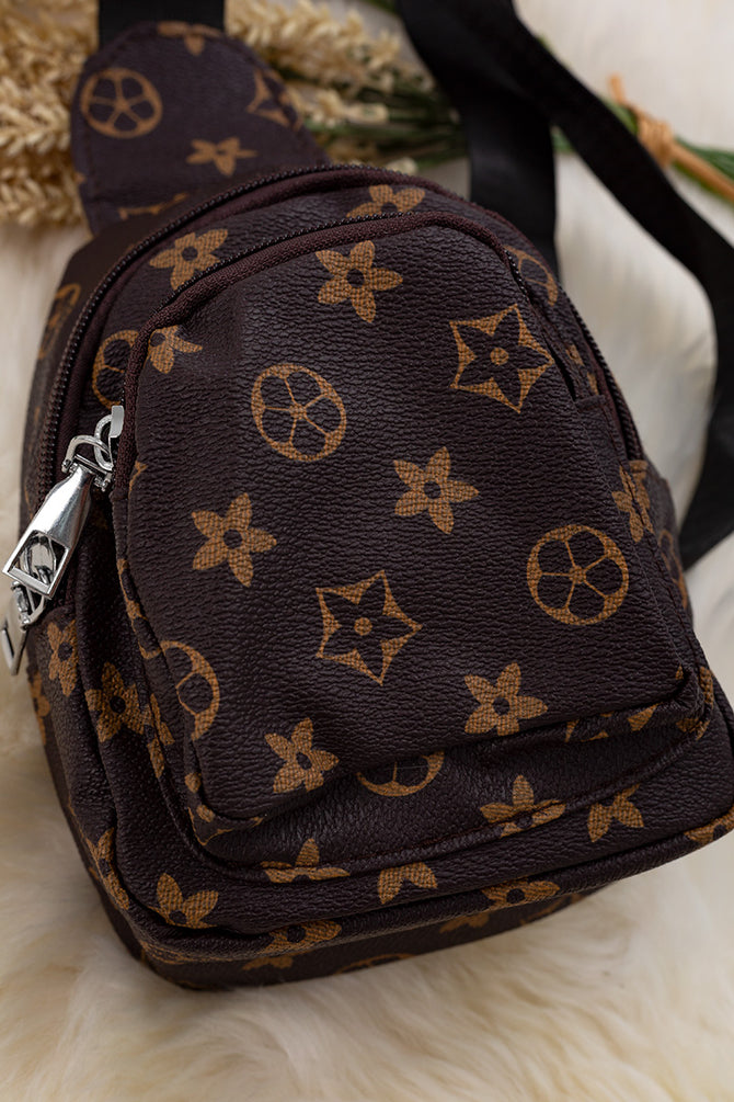 BROWN STAR PRINTED SLING BAG.