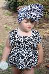 MULTI- COW SPOTTED PRINT BABY ONESIE W/ SNAPS.