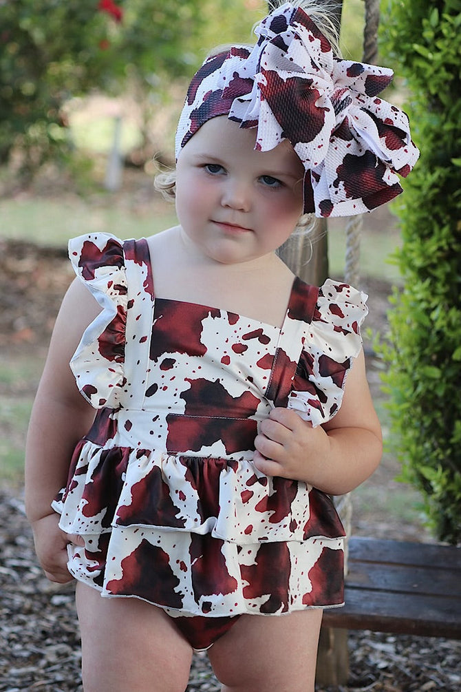 MULTI- COW SPOTTED PRINT BABY ONESIE W/ SNAPS.