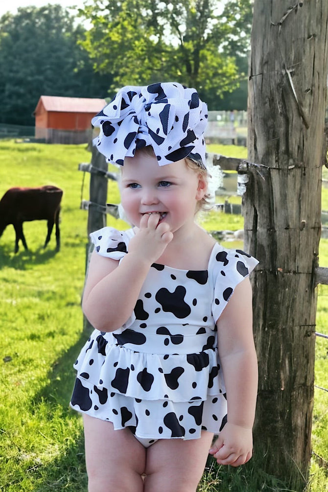 MULTI- COW SPOTTED PRINT BABY ONESIE W/ SNAPS.
