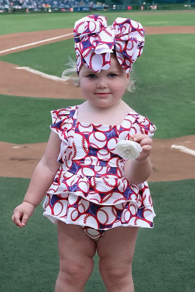 BASEBALL PRINTED BABY ONESIE W/ SNAPS. (HEADBAND IS SOLD SEPARATELY)
